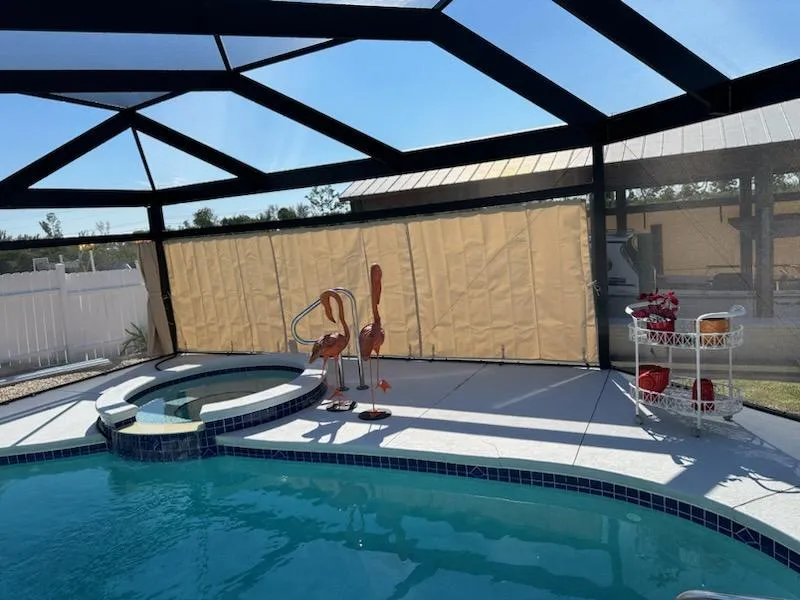 Beige privacy panels around pool area