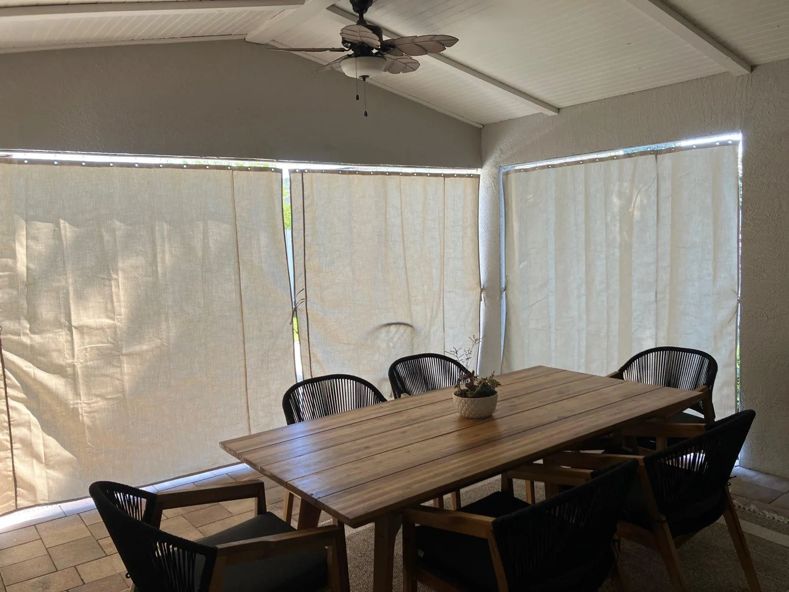 Cream curtains in lanai dining area