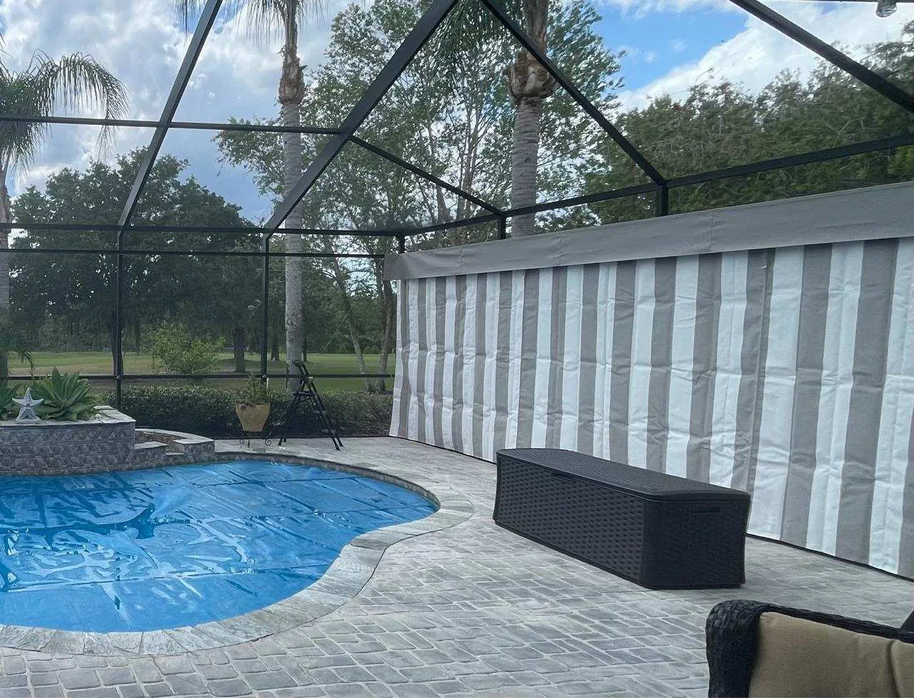 Striped privacy curtains in pool cage