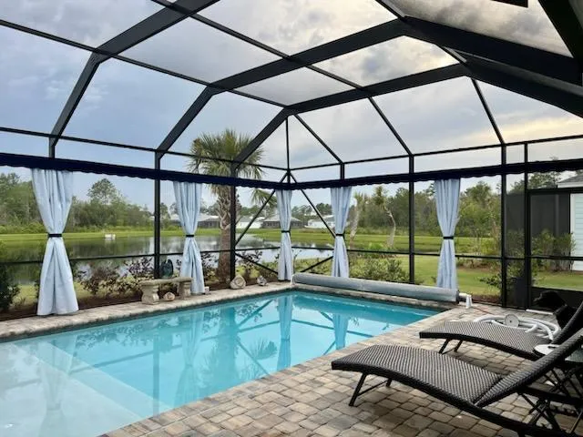Sunbrella outdoor curtains with lake view in Central Florida lanai