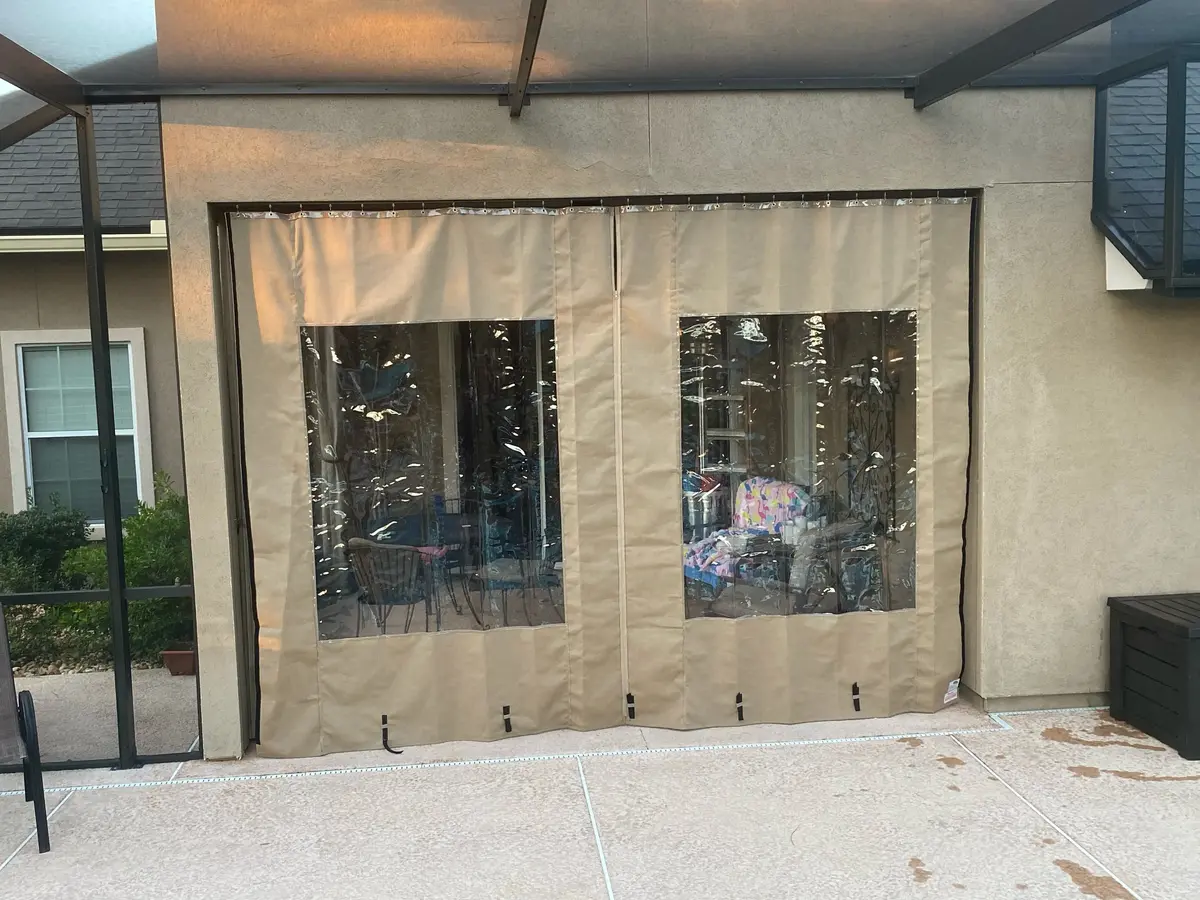 Tan vinyl window curtains on patio
