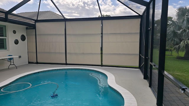 Silica silver roller shades around pool